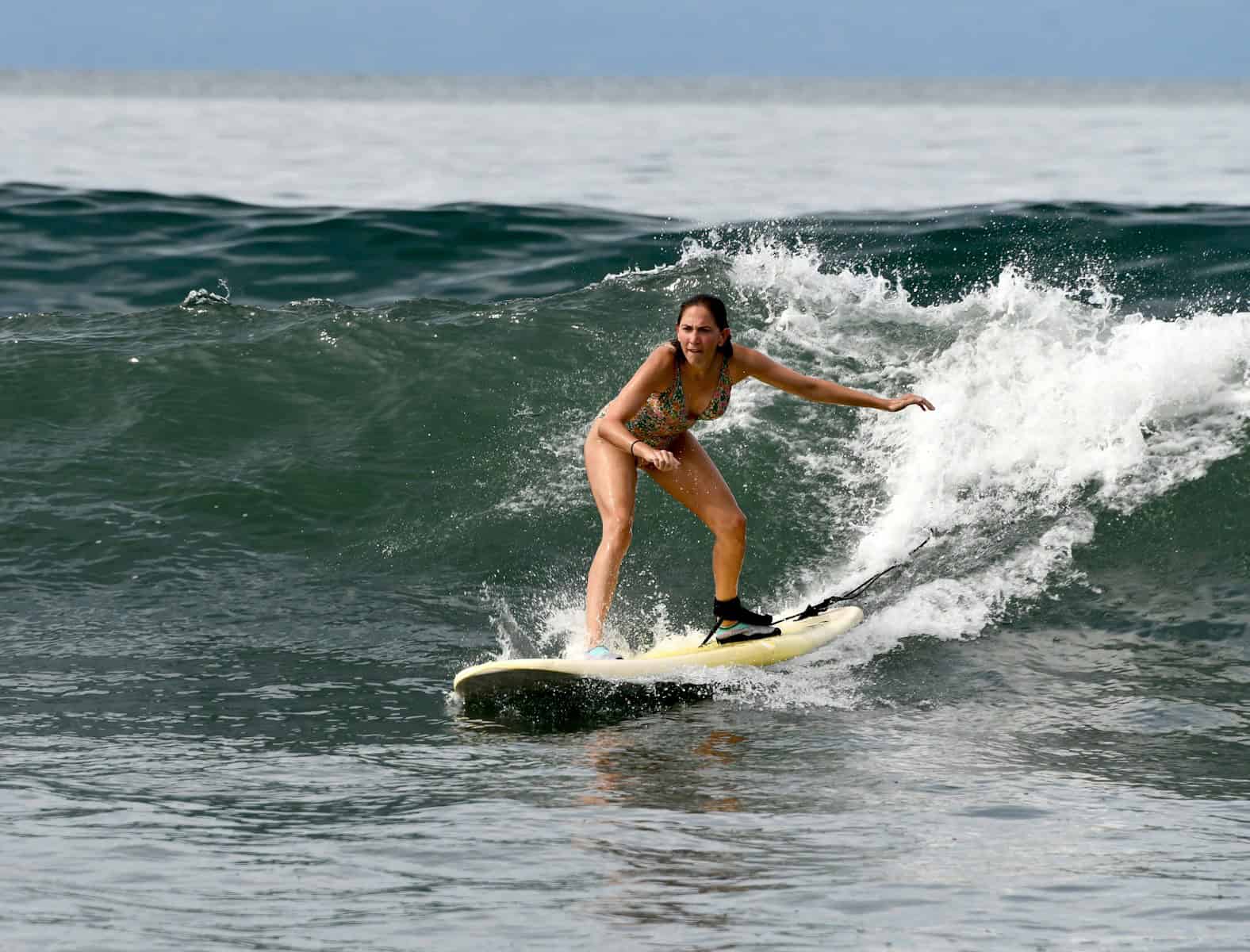 a person surfing on the waves