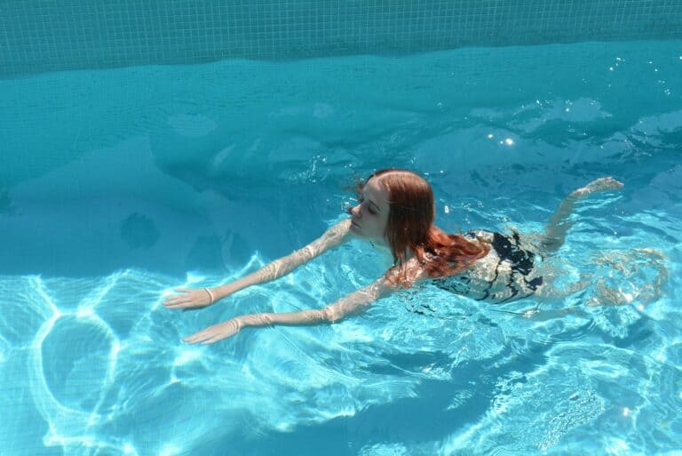 a woman floating in a pool of water