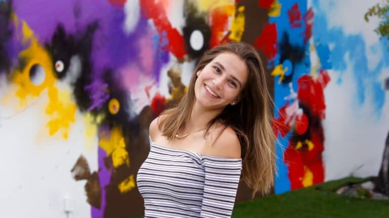 woman in white and black striped off shoulder shirt
